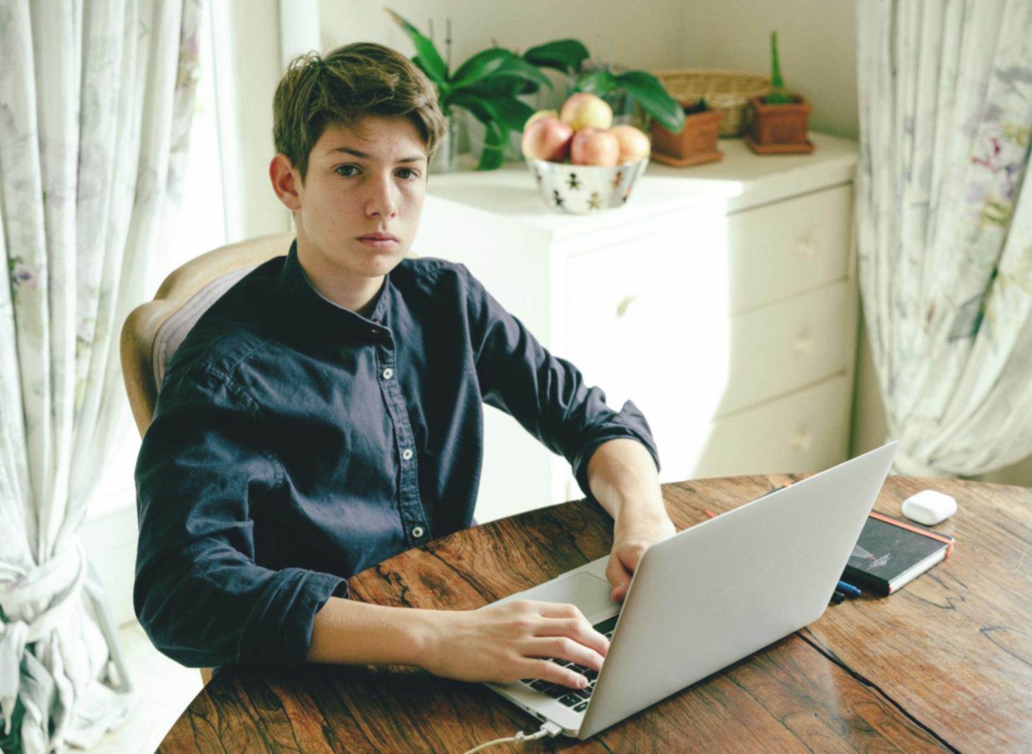 Finance professional analyzing liquidity ratios on computer screen with multiple financial statements